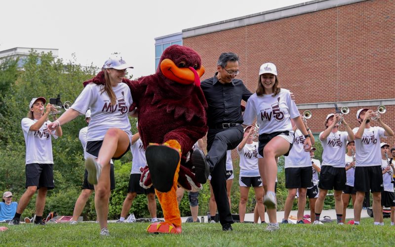 Dean Liu and the Marching Virginians perform together at the welcome picnic.