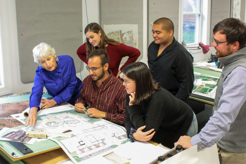 Faculty and students of the Community Design Assistance Center discuss a project together