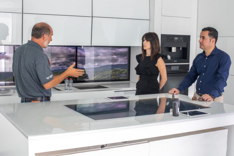 Joe Wheeler presents to two company representatives inside the FutureHAUS.