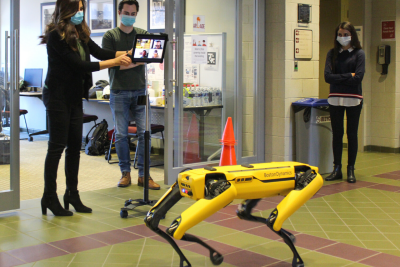 Myers Lawson faculty work with the Spot robot dog