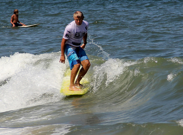 Billy Almond surfing.