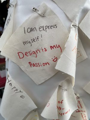 Fabric swatch that reads, "I can express myself! Design is my passion."