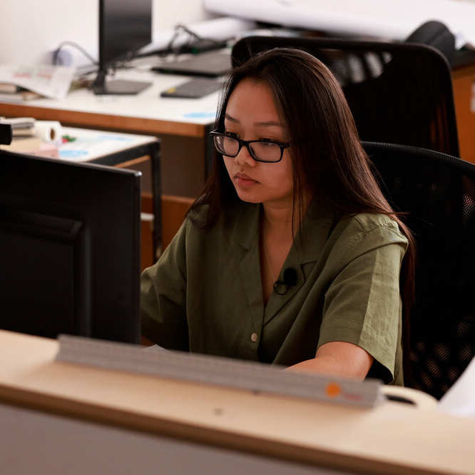 Student working at desk.
